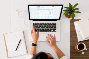 Woman using the Carden IT Support portal on a laptop