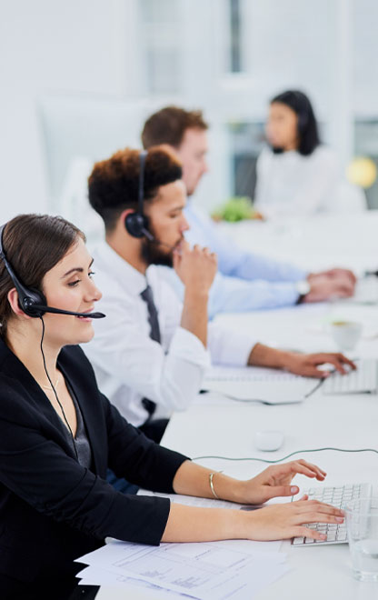 woman in IT support office using telecoms headset