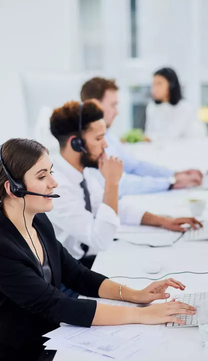 woman in IT support office using telecoms headset