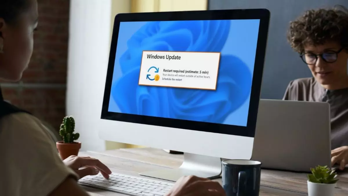 woman using desktop computer with Windows update pending