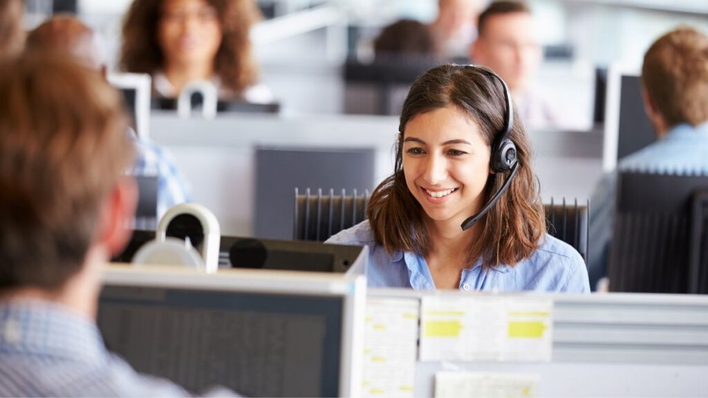 woman at desk working in IT support