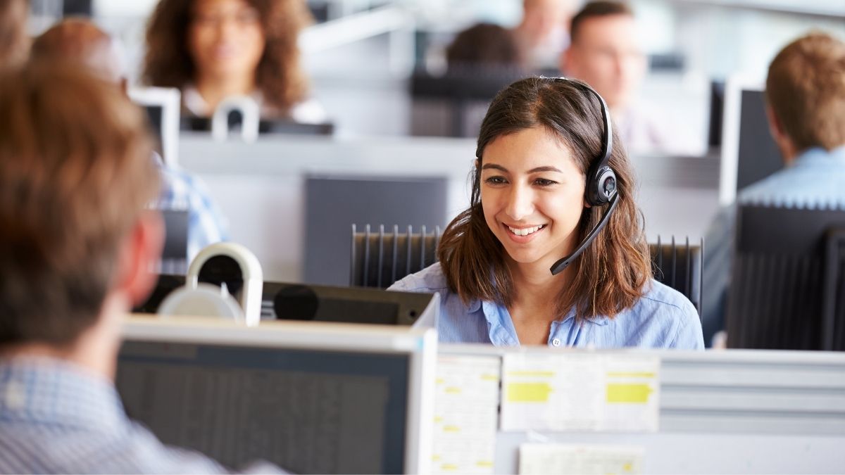 woman at desk working in IT support
