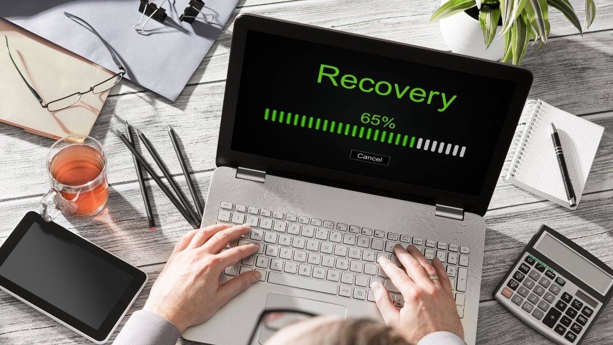 hands using a laptop in disaster recovery mode