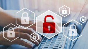 logos of padlocks hovering over hands using a laptop