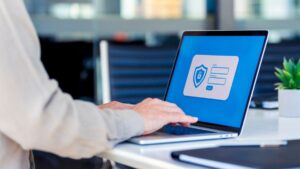 Someone on laptop using a password manager