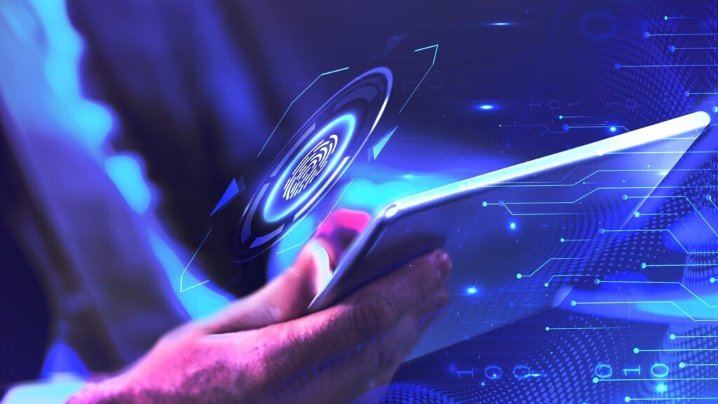 a man's hands using a tablet with a fingerprint logo hovering above it
