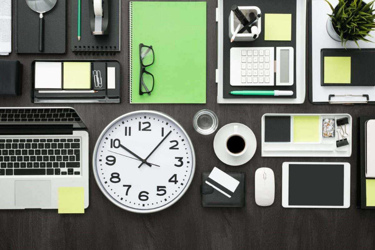 several office items arranged neatly on a desk