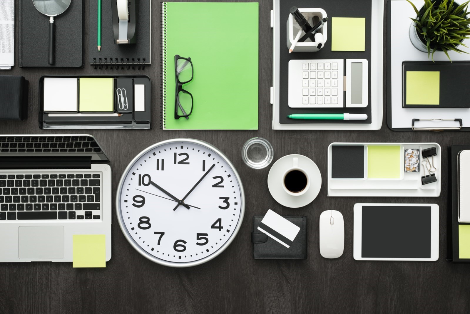 several office items arranged neatly on a desk